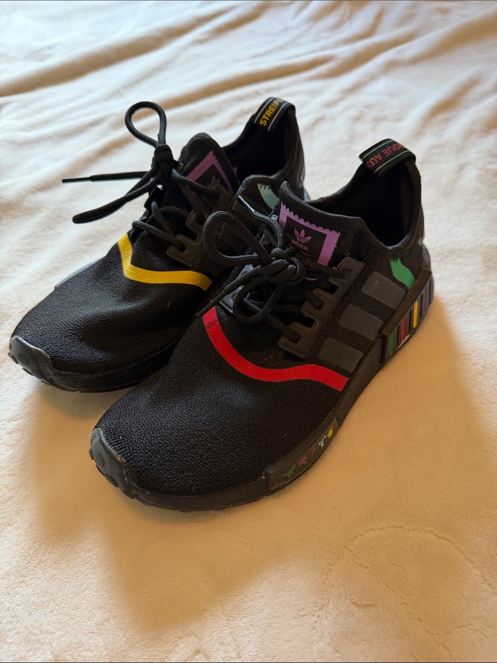 adidas Mens Pixar NMD Black Sneakers with Red, Yellow & Green Accents